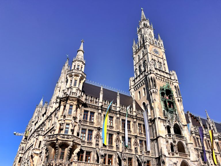 The New Rathaus in Munich’s Marienplatz showcasing its detailed Gothic Revival architecture and tall clock tower against a clear sky, a highlight for anyone exploring 3 days in Munich.