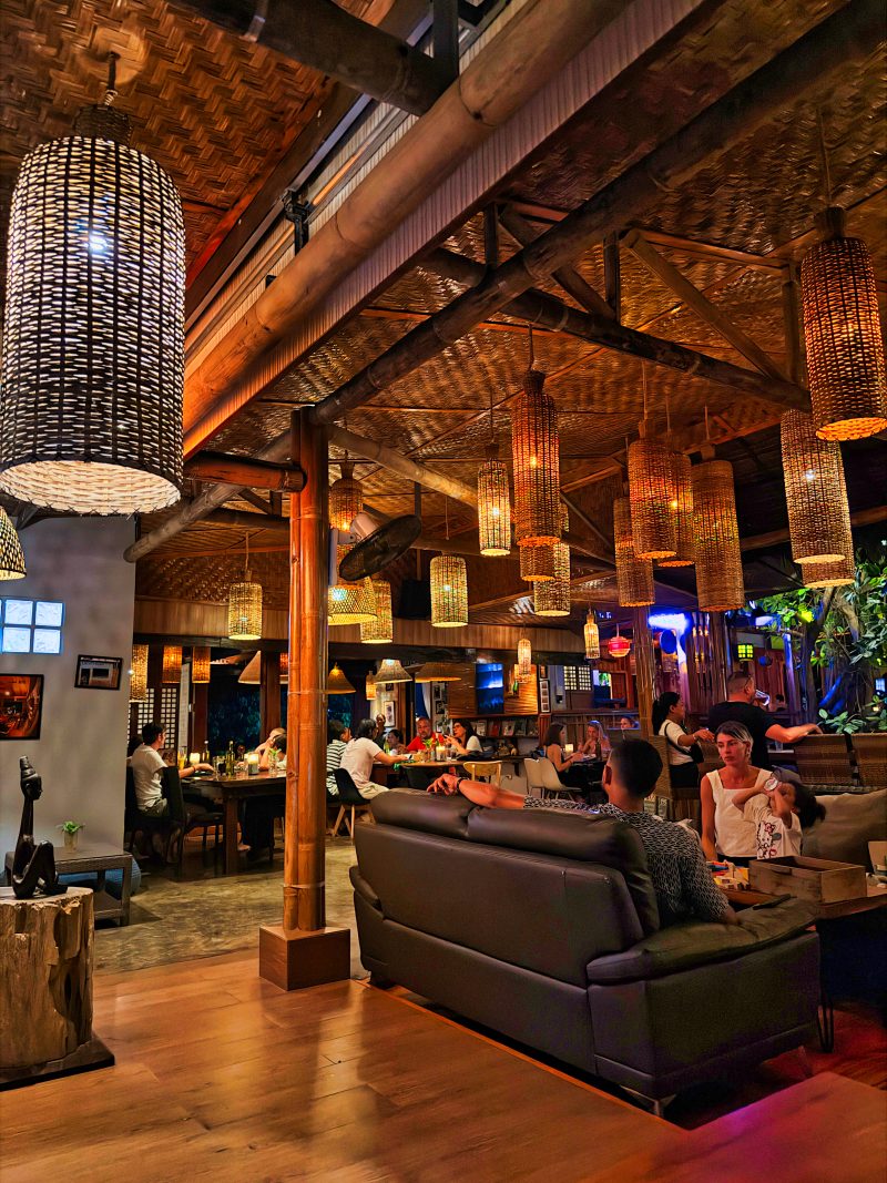 Baha Ba`r in San Juan with warm lights and a relaxed evening atmosphere with high-end Bali and treehouse vibes. The area is known for its laid-back nightlife and social spots near many hotels and guesthouses.