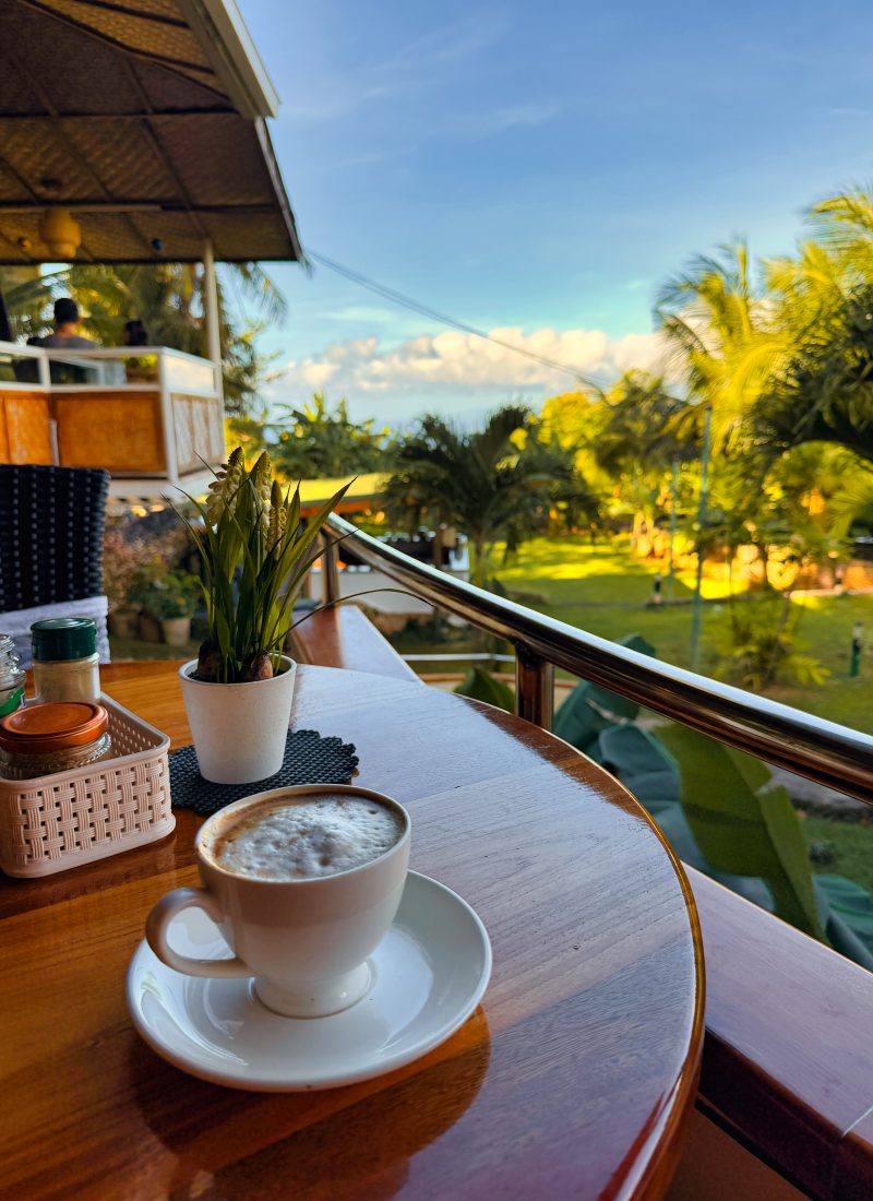 Coffee served on a terrace overlooking green hills at South Mountain Resort in Siquijor. A peaceful stay for travelers who prefer a quieter setting away from the busy main road area.