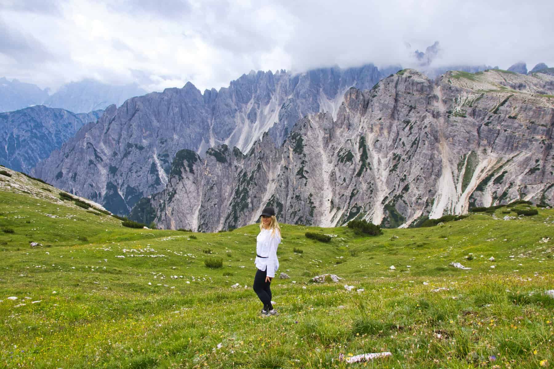 Hiker at a Dolomites viewpoint on the trail to Tre Cime di Lavaredo, Italy