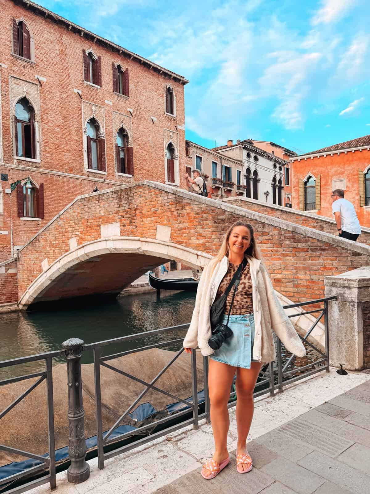 Girl next to the canal in Venice, Italy, after ending a 7-day self guided cycling trip.